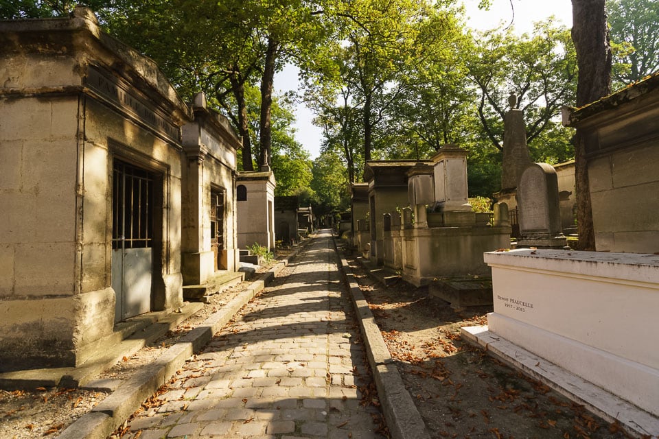 Tomb-lined walkway in Pere Lachaise Cemetery.