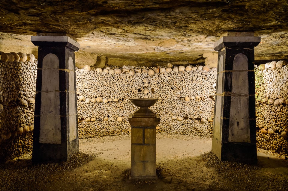 Bones and cemetery decorations in the Paris Catacombs.