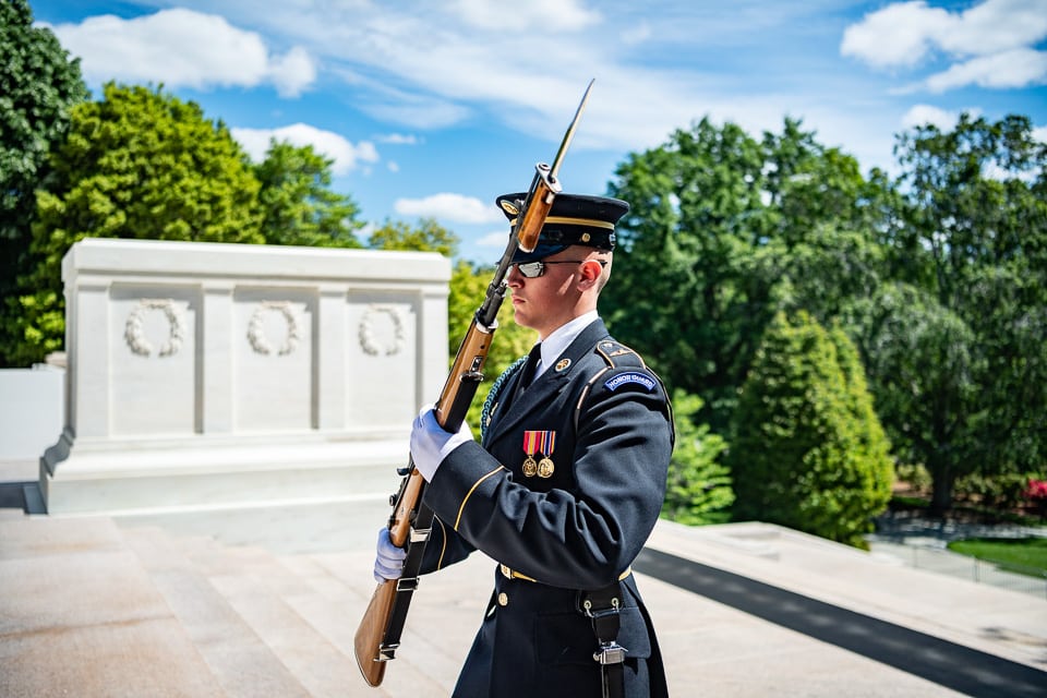 Guard with rifle at the tomb.