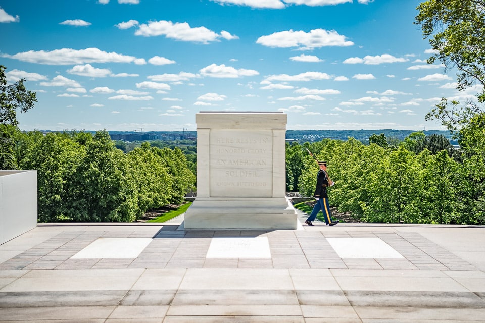 Soldier walking by the Tomb of the Unknown Soldier.