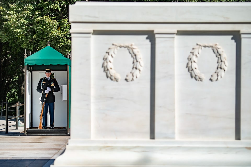Tomb with a guard in the background.