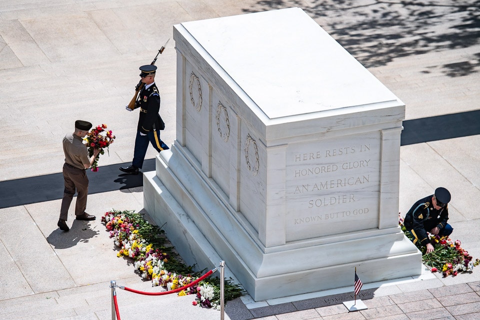 Soldiers laying flowers at the Tomb of the Unknown Soldier in Arlington.