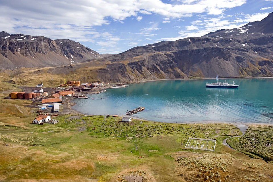 Hillside view of the Grytviken whaling station, cemetery, and King Edward Cove.