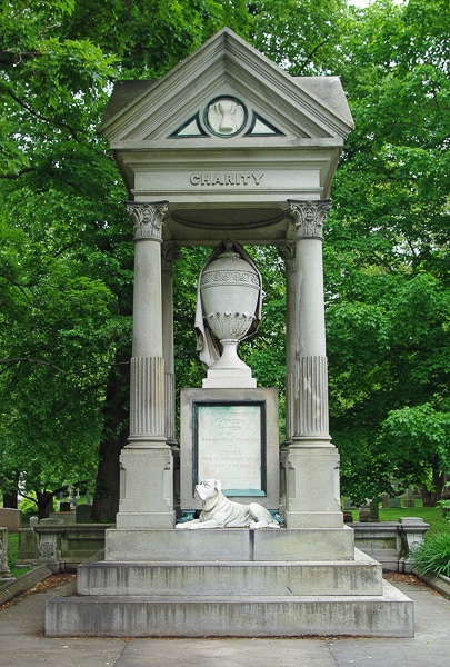 William F. Harnden Monument- a stone canopy covering an urn and dog sculpture.