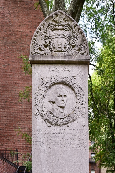 Carved obelisk marking John Hancock's grave.
