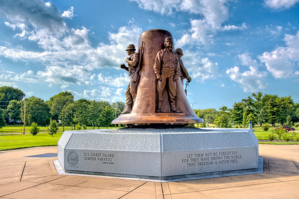 Large bronze bell and statues on the Korean War Memorial in Oak Ridge Cemetery.