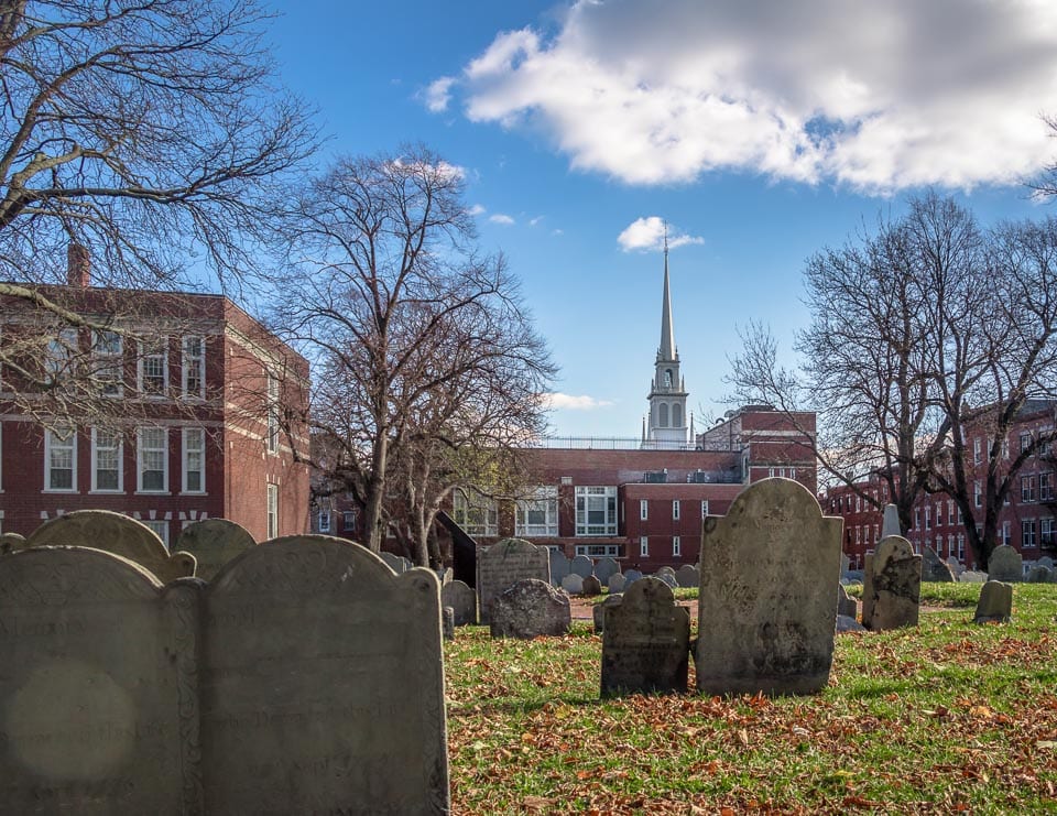 Copp's Hill Burying Ground with brick buildings in the background.