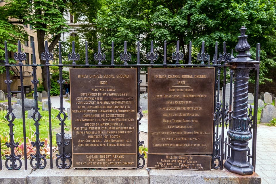 Fence with plaques listing notable burials at King's Chapel Burying Ground.