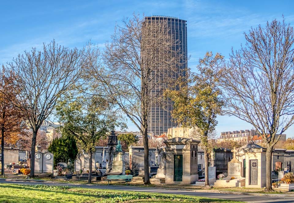 Montparnasse Cemetery with Montparnasse Tower in the background.