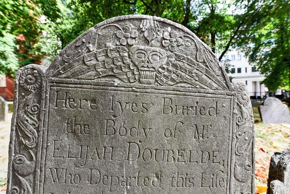 Boston tombstone engraved with death's head.
