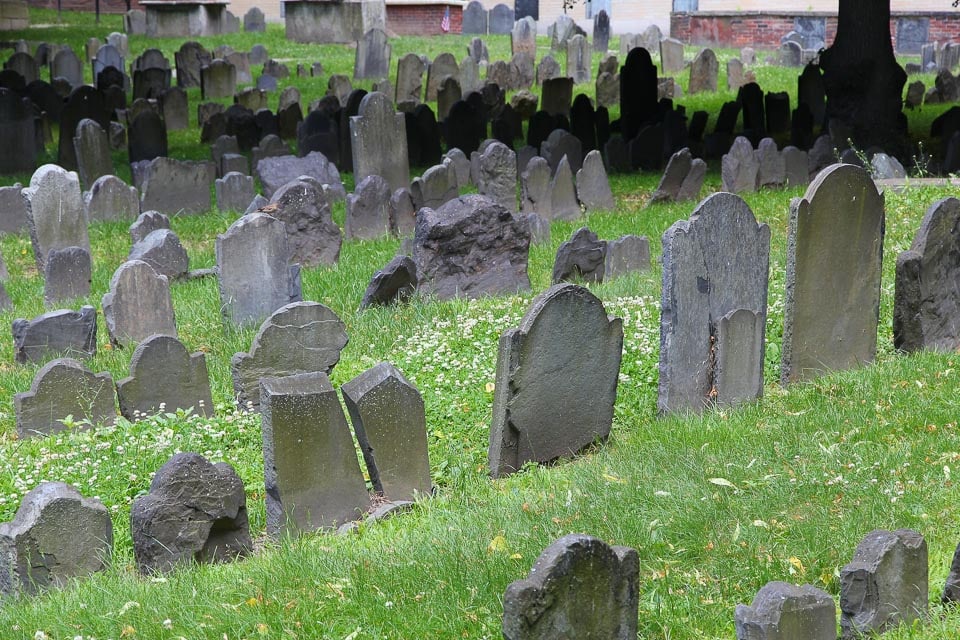 Rows of old tombstones in a Boston cemetery.