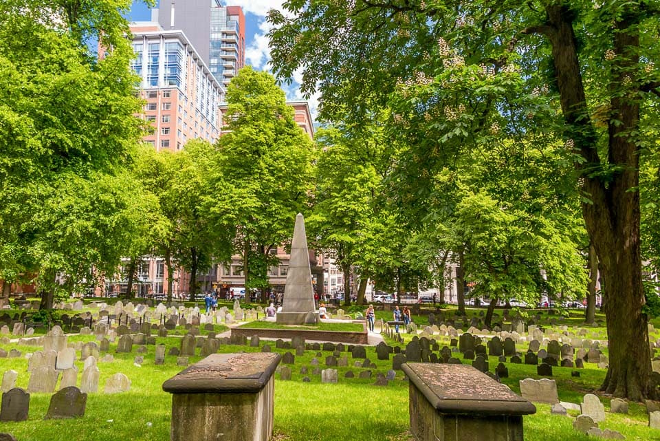 Tombs and gravestones surrounding an obelisk in Granary Burying Ground.