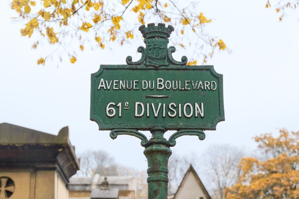 Green street sign in Pere Lachaise Cemetery.