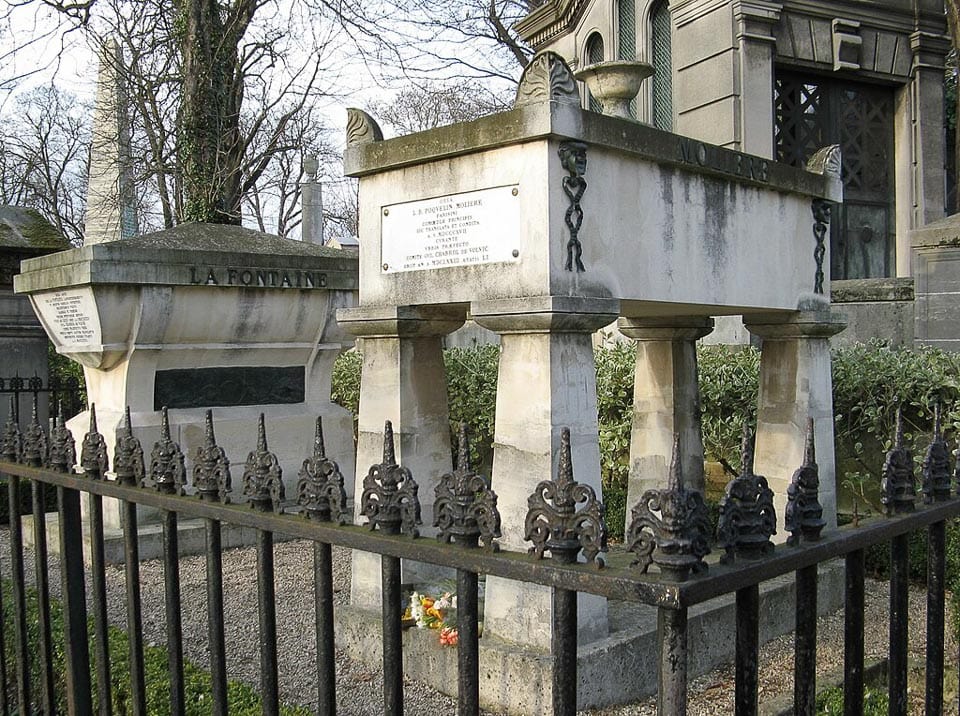 Tombs of Moliere and La Fontaine behind an iron fence.