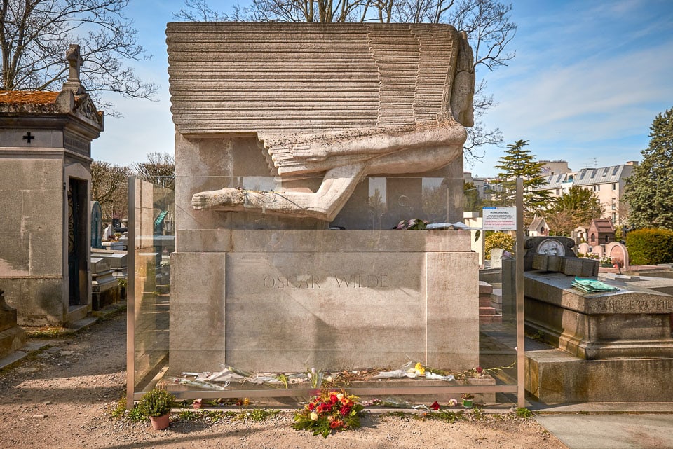 Tomb of Oscar Wilde, one of the most famous burials in Pere Lachaise Cemetery.