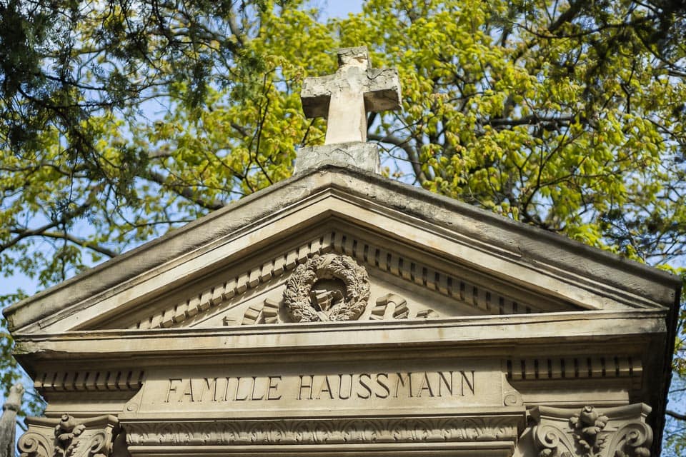 Cross and wreath on the family tomb of Georges-Eugene Haussmann.