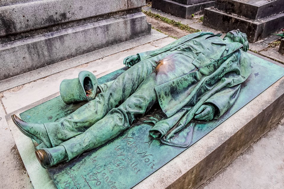 Bronze sculpture of Victor Noir on his grave in Pere Lachaise Cemetery.