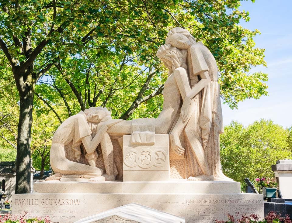 Sculptures on a family grave in Pere Lachaise Cemetery.