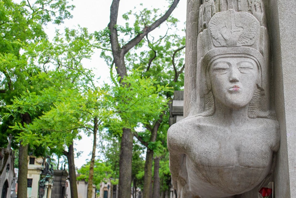 Sculpture of a winged angel on Oscar Wilde's tomb.