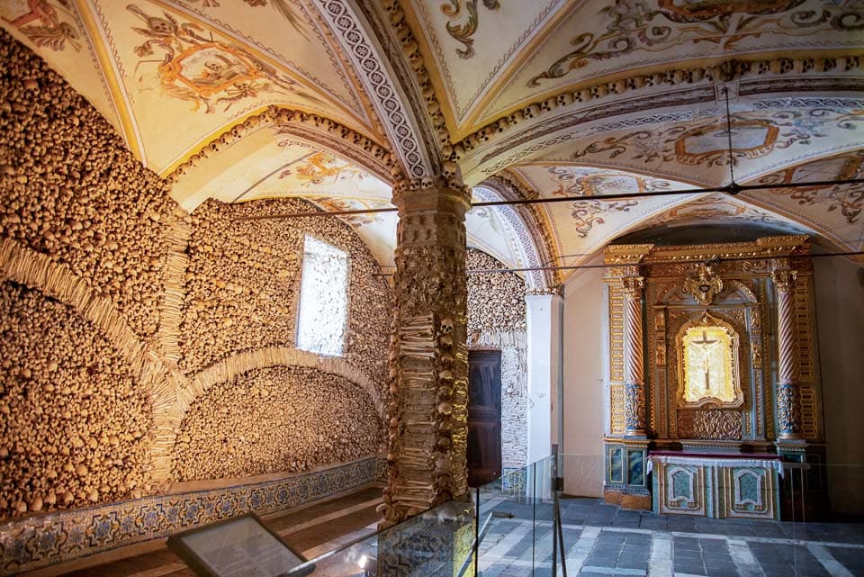 Altar and a wall of bones inside the chapel.