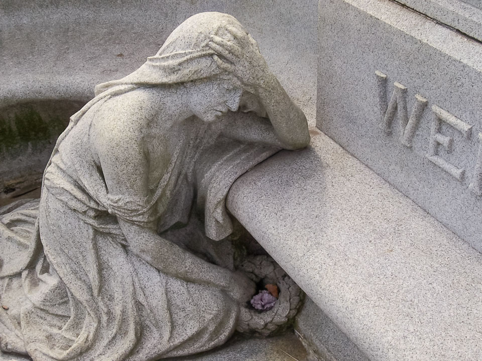 Mourning woman sculpture at Houdini's grave. 