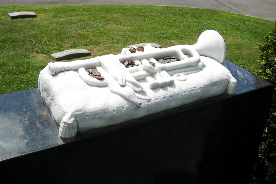 Trumpet sculpture on Louis Armstrong's headstone.